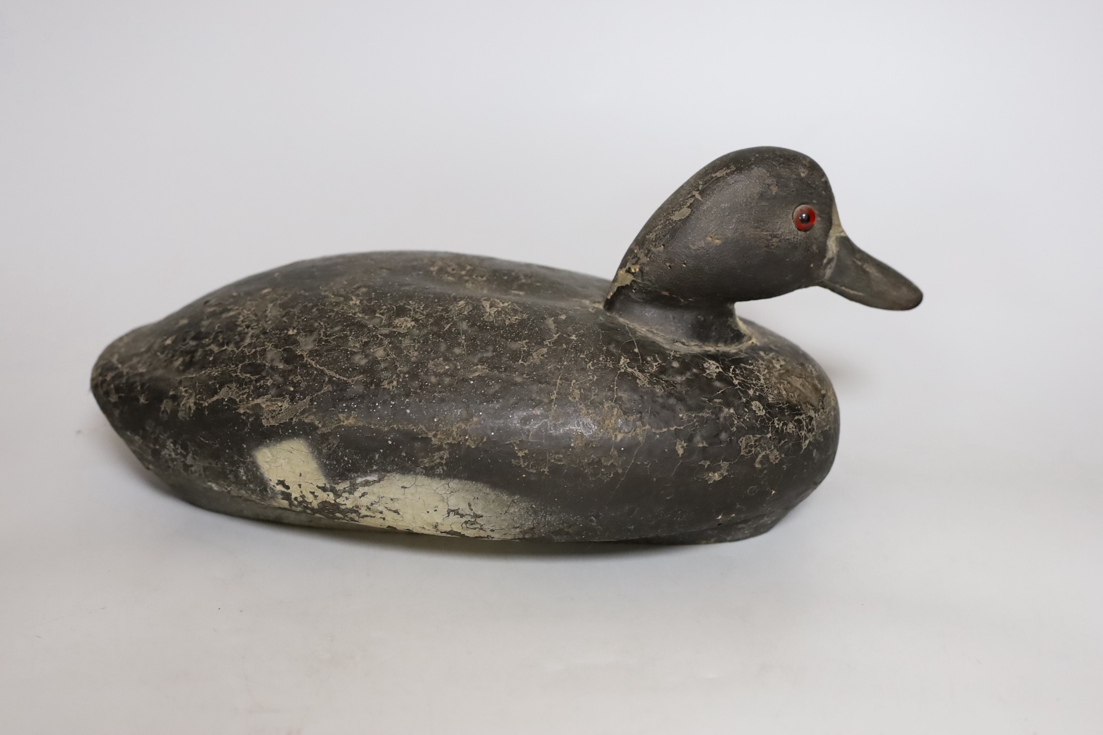 A 19th century painted decoy duck. 33cm long